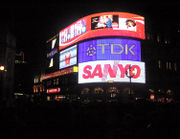 Neon signs of Piccadilly Circus by night