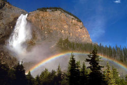 Rainbow in the spray and mist of the waterfall at Takakkaw Falls, Canada