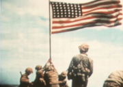 Flag raised atop Suribachi (from 16mm color film), by Marine Sgt. Bill Genaust