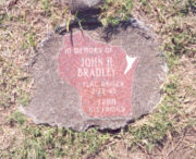 The plaque placed on Mount Suribachi by John Bradley's family, shaped like the state of Wisconsin