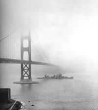 The USS San Francisco steams under the Golden Gate Bridge in 1942, during World War II