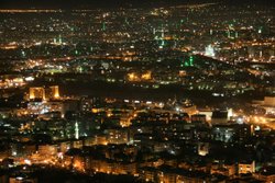 Damascus by night, pictured from Jabal Qasioun; the green spots are minarets