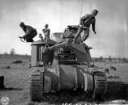 Abandoning a disabled M-3 tank in training