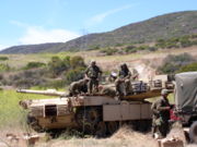 An M1 Abrams engine undergoing maintenance by the crew, with the turret turned sideways to expose the engine deck. Photo from B Company, 4th Tank Battalion, 4th Marine Division, US Marines.