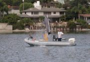 An NMMP team performs for onlookers at Shelter Island, San Diego.