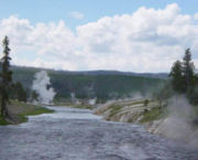 The Firehole River near Excelsior Geyser. Due to the volume of heated water pouring into the river from the geothermal features, the temperature of the river can get as high as 86 °F (30 °C).