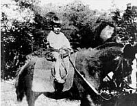 Guevara on a burro at the age of 3