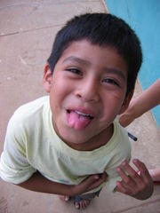 Boy showing tongue.