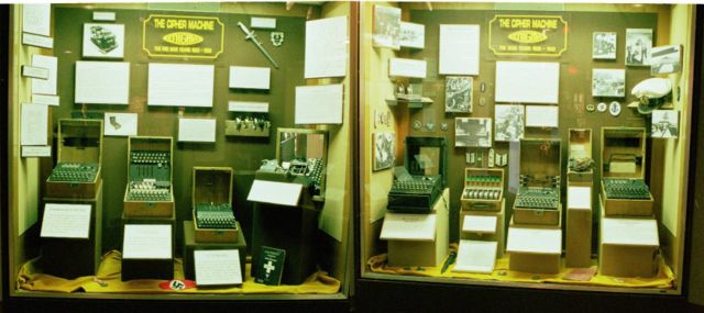 A selection of seven Enigma machines and paraphernalia exhibited at the USA's National Cryptologic Museum. From left to right, the models are: 1) Commercial Enigma; 2) Enigma T; 3) Enigma G; 4) Unidentified; 5) Luftwaffe (Air Force) Enigma; 6) Heer (Army) Enigma; 7) Kriegsmarine (Naval) Enigma — M4.