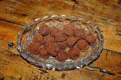 Chocolate truffles typically have a thin shell of powdered chocolate with a soft creamy center.