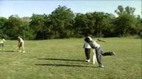 Children playing cricket on a makeshift pitch in a park. It is common in many countries for people to play cricket on such pitches.