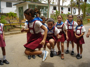 School children playing jump-rope in between classes at an elementary school in the Cuban countryside