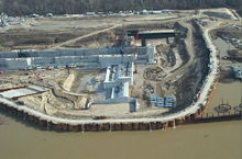 A cofferdam during the construction of locks at the Montgomery Point Lock and Dam. 