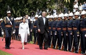 Philippine President Gloria Macapagal-Arroyo with George W. Bush inspects the Malacanang Palace Honor Guards during the latter's 8-hour State Visit to the Philippines in October 2003