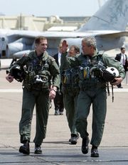 President Bush, with Naval Flight Officer Lieutenant Ryan Philips, in the flight suit he wore for his televised arrival and speech aboard the USS Abraham Lincoln in 2003.