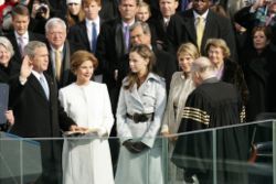Bush sworn into his second term on January 20, 2005 by Chief Justice William Rehnquist, watched on by First Lady Laura Bush and their daughters Barbara and Jenna Bush, as well as Senate Majority Leader Bill Frist and Speaker of the House Dennis Hastert.