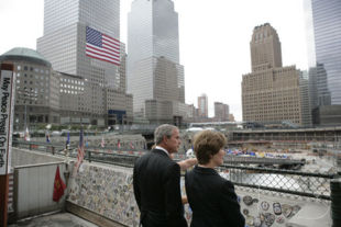 President George W. Bush and Laura Bush look over the World Trade Center site during a visit to Ground Zero in New York City to mark the fifth anniversary of the September 11th terrorist attacks.