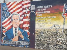 A mural of President Bush in West Belfast, Northern Ireland, depicting the local population's perception of his foreign policy and relationship with the British government.