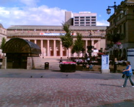 Dundee City Square. The building at the back of the square is Caird Hall. The building on the right is Dundee City Chambers, where the city council meets