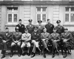 Eisenhower (seated, middle) with other American military officials, 1945.