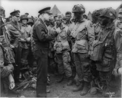 Eisenhower speaks with U.S. paratroops of the 502d Parachute Infantry Regiment, 101st Airborne Division on the evening of June 5, 1944.