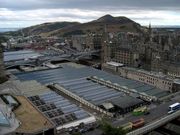 View of Edinburgh from the Scott Monument on Princes Street, showing Waverley Station in the foreground and Arthur's Seat beyond.