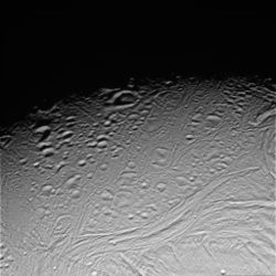 Figure 5: Degraded craters on Enceladus, imaged by Cassini, 17 February 2005. Hamah Sulci can be seen running from left to right along the bottom quarter of the image.  Craters from Enceladus' ct2 and cp cratered units are visible above Samarkand Sulci