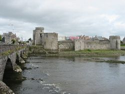 King John's Castle, built in the 13th century, lies alongside the River Shannon. Thomond Bridge also still stands, seen on the left of this photograph.