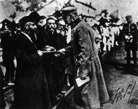 Representants of the Polish Jewish community in Dęblin welcome Marshal of Poland, Józef Piłsudski, with bread and salt after the liberation of the city from the bolsheviks during the Polish-Soviet War, 1920.