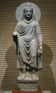 One of the first known representations of the Buddha, Gandhara, in pure Hellenistic style and technique: Standing Buddha (Tokyo National Museum).