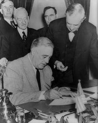 Roosevelt signing the declaration of war against Japan, December 1941