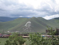 Chinggis Khan portrait on Ulan Bator hillside, done for 2006 Naadam festival