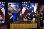 Former President George H. W. Bush views a model of the aircraft carrier that has been named in his honor