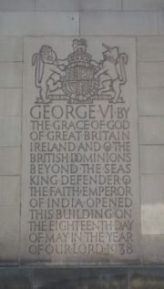 A plaque on the Manchester Town Hall records George VI's titles before giving up the title Emperor of India.