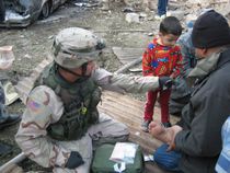 American soldier and an Iraqi child