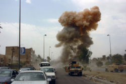 As Coalition Forces respond to a car bombing in South Baghdad, Iraq (IRQ), a second car bomb is detonated, targeting those responding to the initial incident. Date Shot: 14 Apr 2005