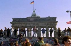 Germans dancing at the Brandenburg Gate after the fall of the Berlin Wall.