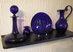 Metallic additives in the glass mix can produce a variety of colors. Here cobalt has been added to produce a bluish colored decorative glass.