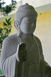 A stone image of the Buddha.