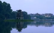 Hoàn Kiếm Lake in the center of Hanoi, with the streets of the old town in the background (1999)