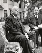 Hoover seated (left) with Arthur Flemming at Ohio Wesleyan University