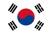 The flag of South Korea, with Taeguk in the center with four trigrams representing Heaven, Water, Earth, and Fire (beginning top left and proceeding clockwise).