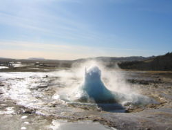 Strokkur, in the process of erupting. Lying on the Mid-Atlantic Ridge, Iceland is one of the most geologically active areas on Earth.