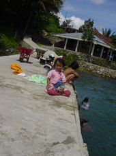 Children playing in Lake Toba