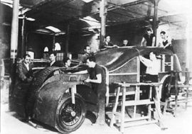 Spain, 1936. Members of the CNT construct armoured cars to fight against the fascists in one of the collectivised factories.