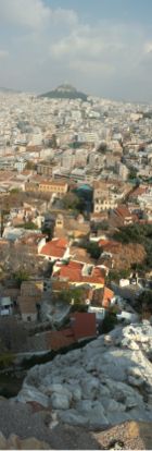 Vertical panorama of part of central Athens from its Acropolis. In the background: the picturesque Anafiotika district and the Lykavittos Hill
