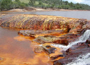 The red appearance of this water is due to iron in the rocks.