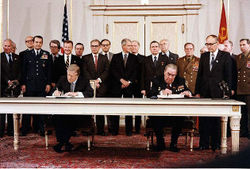 President Jimmy Carter and Soviet General Secretary Leonid Brezhnev sign the Strategic Arms Limitation Talks (SALT II) treaty, June 18, 1979, in Vienna.
