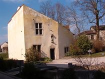 Joan of Arc's birthplace is now a museum. The village church where she worshipped is on the right behind several trees.