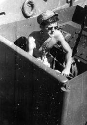 Lt. Kennedy on his navy patrol boat, PT 109.